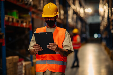 Warehouse worker checking goods at warehouse