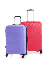 Modern suitcases for travelling on white background