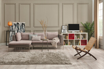 Grey sofa in the brown wall, home decoration working table carpet and chair style.