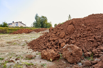 Piles of sand. A heap of building material for bedding or an ingredient for mixing cement....