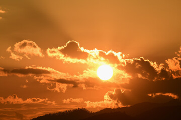 Rain cloud with evening sunset light.