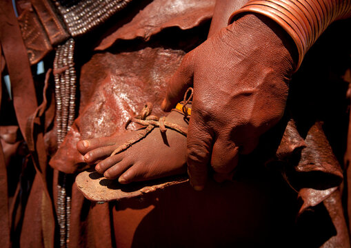 Hand Of A Muhimba Woman Holding A Baby Foot, Village Of Elola, Angola