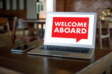 WELCOME ABOARD Business team hands at work with financial WELCOME ABOARD Concept