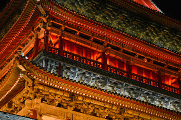Fototapeta premium Xian Drum Tower building section facade illuminated by Night