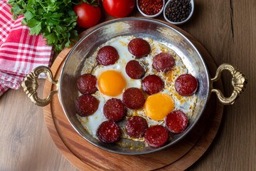 Turkish style fried egg with sausage