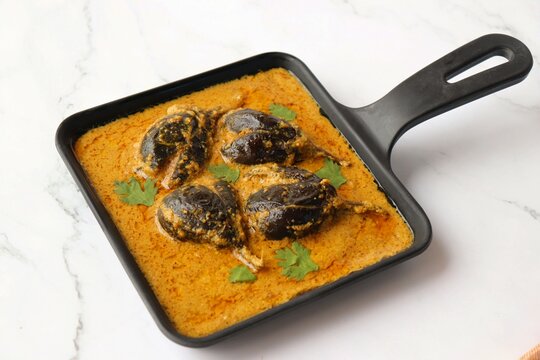 Baghare baingan, Baingan masala, Eggplant or brinjal curry, Bharli vangi. Khare vanga served in pan. Copy space.