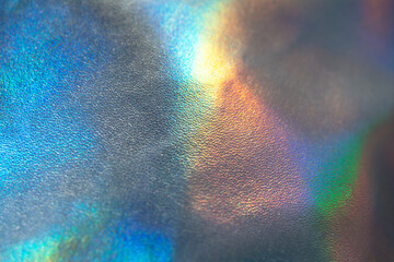 Holographic rainbow iridescent wrinkled background. Abstract and blurred backdrop for your ideas