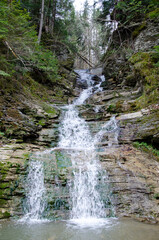 Mountain forest river water landscape. Waterfall in Carpathian Mountains, Ukraine.