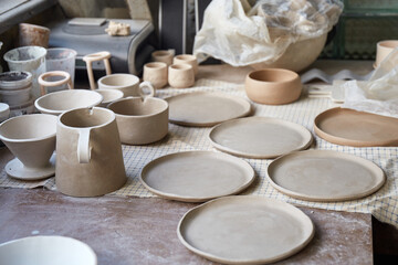 Pottery studio The process of creating pottery. The master ceramist works in her studio. workplace of potter