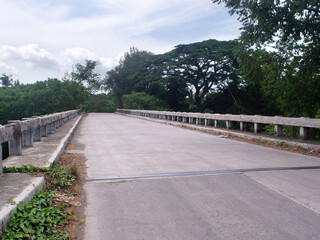 Fototapeta na wymiar Affordable and cheap short-span concrete river bridge in the Philippine countryside.