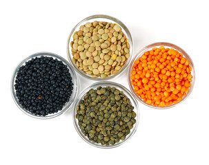 assortment of lentils in a glass bowl isolated on white background