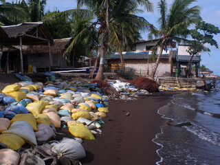 Unsightly sandbags we laid along the seashore resort houses to keep them from further inundation...