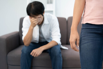 The woman was disappointed and saddened after an argument with her husband. Asian couples are...