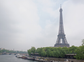 Fototapeta premium View of the Port de Suffren and the Eiffel Tower. In the port there are ships and cars