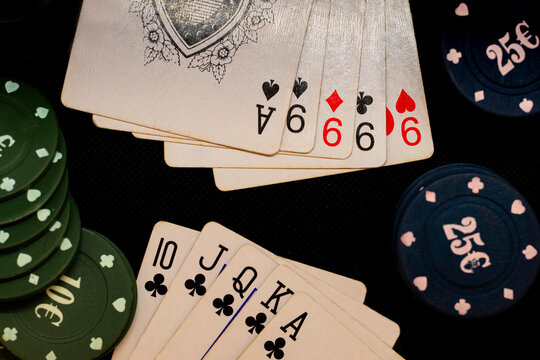 Poker of nines against straight flush, poker chips and cards, winning combination
