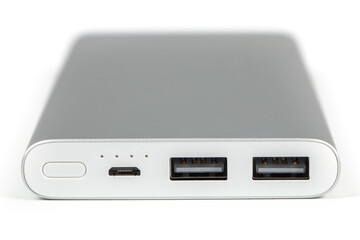 Fototapeta premium Power bank for charging mobile devices. White smart phone charger with power bank battery bank . External battery for mobile devices.