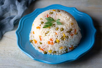 Delicious vegetable rice pilaf with green peas, carrots and sweet corn
