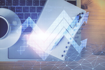 Double exposure of arrows drawing and work table top veiw. Concept of growth.