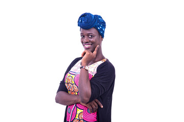 beautiful young woman crossing her arm with raised finger on cheek smiling.