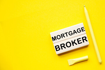 MORTGAGE BROKER with informationon on the a yellow background desktop .