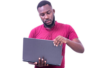 young businessman holding laptop.