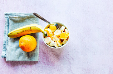Healthy breakfast of a bowl of fruit. Healthy meal orange with banana