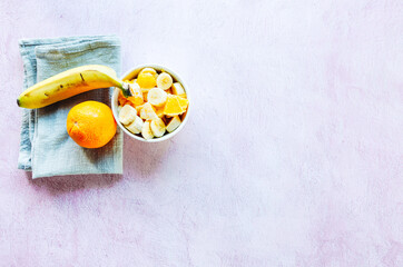 Healthy breakfast of a bowl of fruit. Healthy meal orange with banana