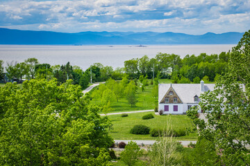 Fototapeta premium View on the Musée de la Mémoire Vivante historic building and the St Lawrence River from the innovation tower, an observation tower in St Jean Port Joli in Quebec (Canada)