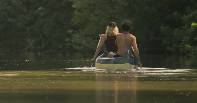Canoeing in a lush summer landscape