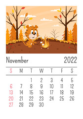 Design template. Calendar for 2022, November. Cute cartoon tiger roasts marshmallows on a campfire in the forest. Autumn landscape. The symbol of the year. Animal character. Color vector illustration.