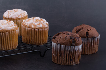 Chocolate dark muffins on wire rack close up.