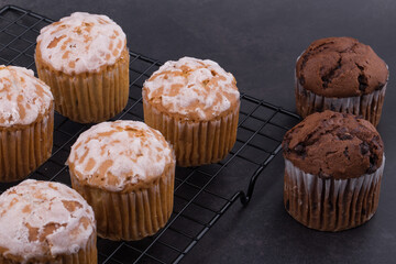 Chocolate dark muffins on wire rack close up.