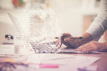 Double exposure of woman hands working on computer and brain hologram drawing. Ai concept.