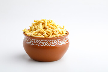 Bhavnagari Gathiya is a very popular Gujarati snack, brown bowl on white background