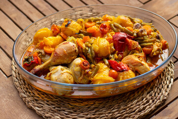 Roasted chicken with vegetables in a Jena glass bowl