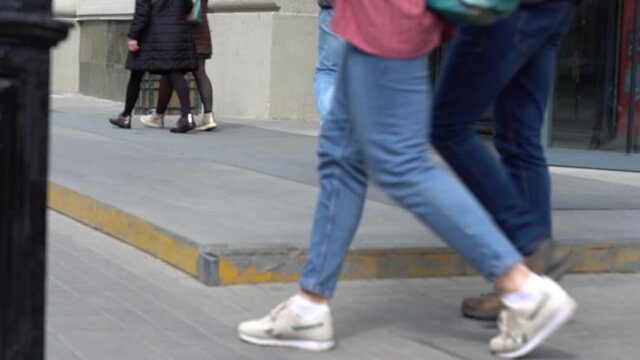 Legs of people in the street. Entrance to the shopping center. Self-sliding doors open. Slowmotion.High quality FullHD footage