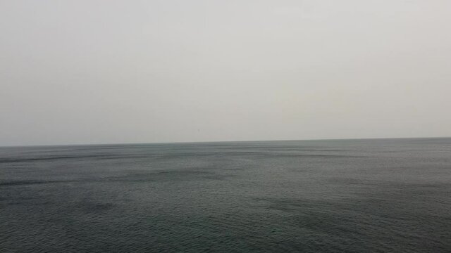 aerial footage of the sea in the coast of the basque country