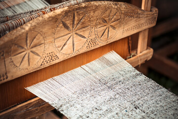 Closeup of an old hand-weaving vintage wooden loom