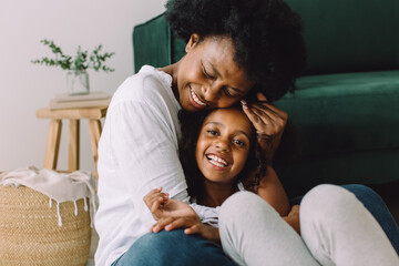 Loving mother and daughter at home
