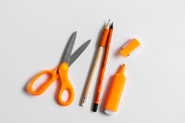 Stationery products. Scissors. Office day. Orange.