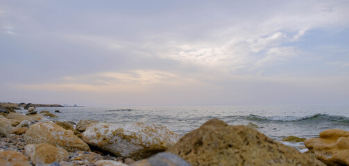 Magical sunset background natural colours crashing wave Cyprus landscape beach sea stone . High quality photo