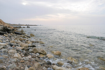 Magical sunset background natural colours crashing wave Cyprus landscape beach sea stone . High quality photo