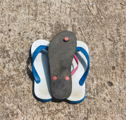 flip-flops in blue, white and black with a classic design. very good for products, business and creativity ideas.