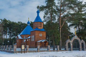 a majestic wooden church among the trees