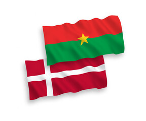 Flags of Denmark and Burkina Faso on a white background