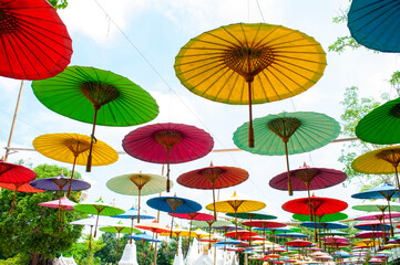 Fototapeta na wymiar Colorful paper umbrellas at Asian festivals