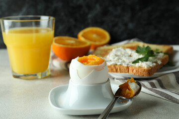 Concept of tasty breakfast with boiled egg, close up