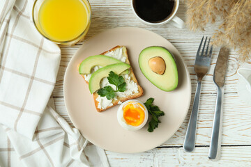 Concept of tasty breakfast with boiled egg, top view
