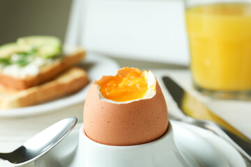 Concept of tasty breakfast with boiled egg, close up