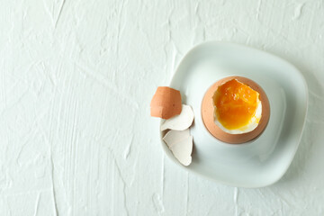 Concept of tasty breakfast with boiled egg, space for text